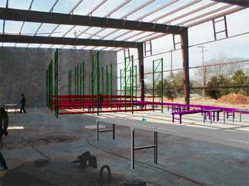 partially assembled pallet rack in a warehouse under construction