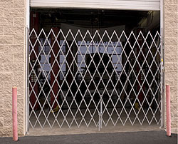 folding gate across an overhead door opening
