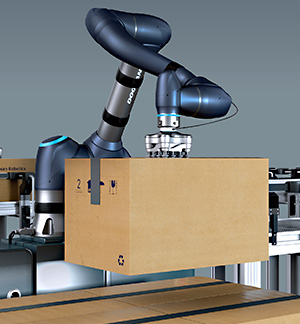 Industrial robot moving a carton