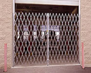 Double gate across an overhead doorway