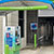 Lime green clearance bar hanging in a car wash