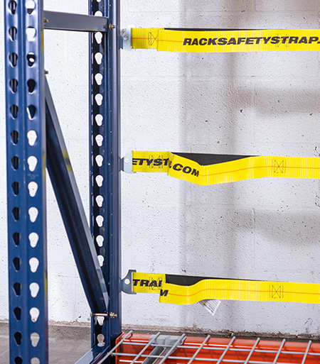 Pallet rack safety staps installed on a teardrop rack.