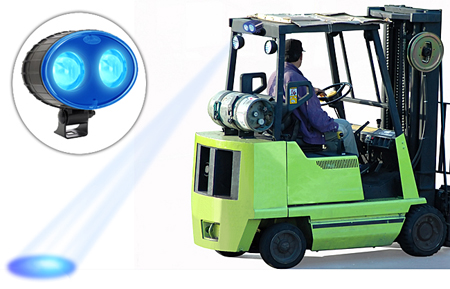 Inset of blue forklift safety light with a blue light in use on a forklift