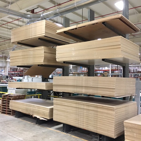 Cantilever racking with stacks of heavy sheet wood