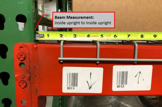 tape measure along a rack beam, next to the upright