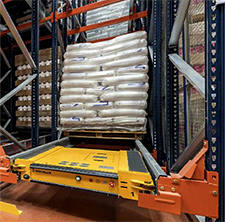 Pallet shuttle with palletized load of bagged material