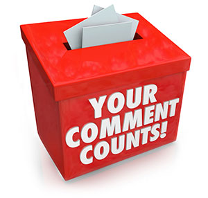 red comments box stuffed with comment slips