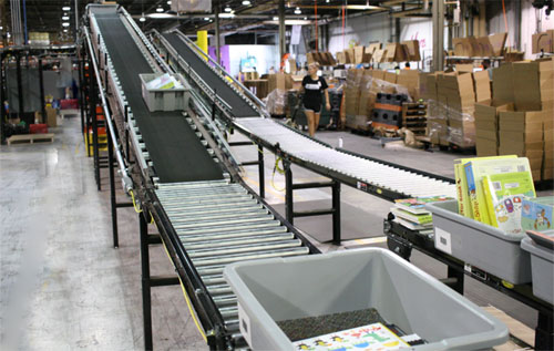 Bins on a conveyor system, transported from picking to packing function.