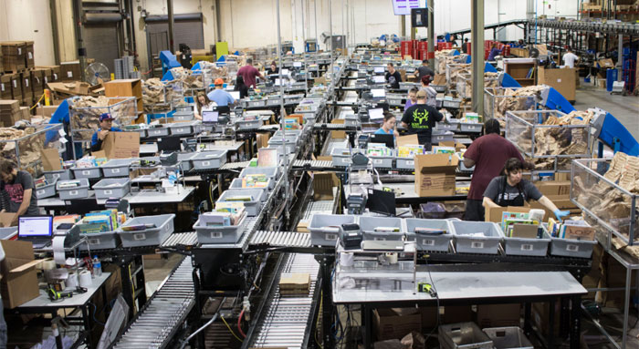 packing and scanning area in a distribution facility