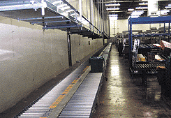 tote traveling on conveyor line in GroceryWorks warehouse