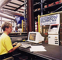 worker operating RTS computer for AS/RS at Hargrove Manufacturing