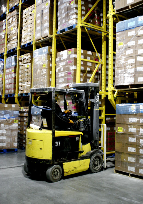 Forklift enters a storage lane