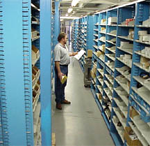 row of shelving with bins