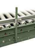 Adjustable guard rail for conveyor