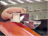 beam hanger connects flow tracks to pallet rack beams