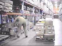 picking from a floor level pallet in a warehouse rack