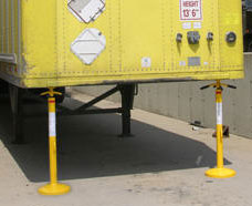 trailer jacks positioned under a trailer