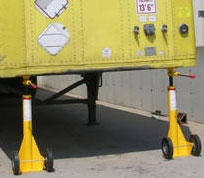 trailer jacks positioned under a trailer